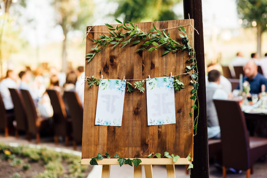 Farm wedding: 2 lists hanging on a wooden board