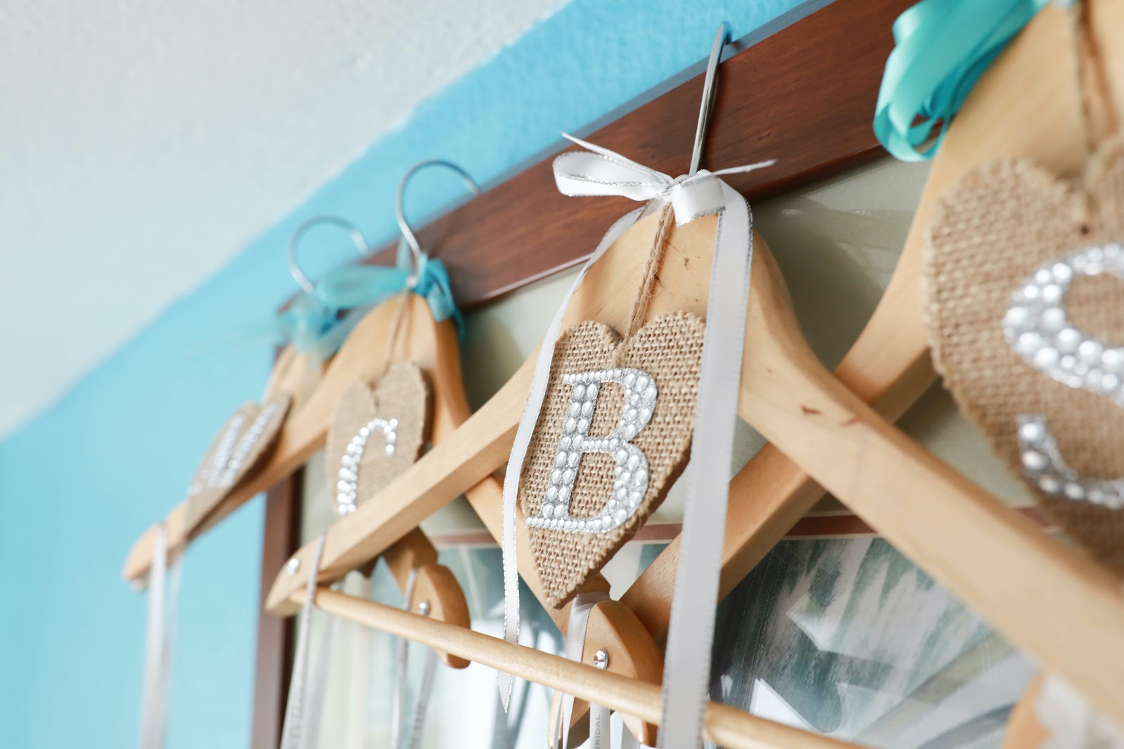 Personalized wooden hangers with silk bows