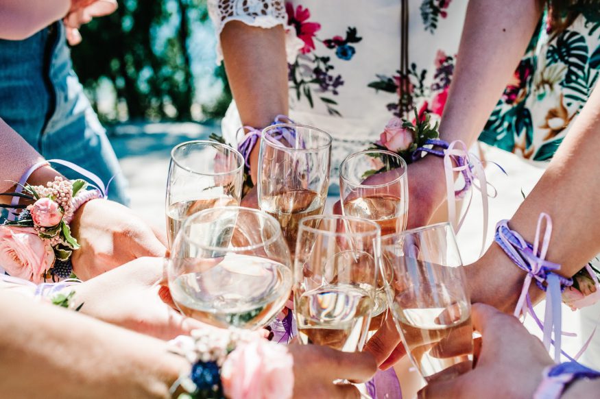 Bachelorette party ideas: Women cheers with wine glasses at a wine tasting