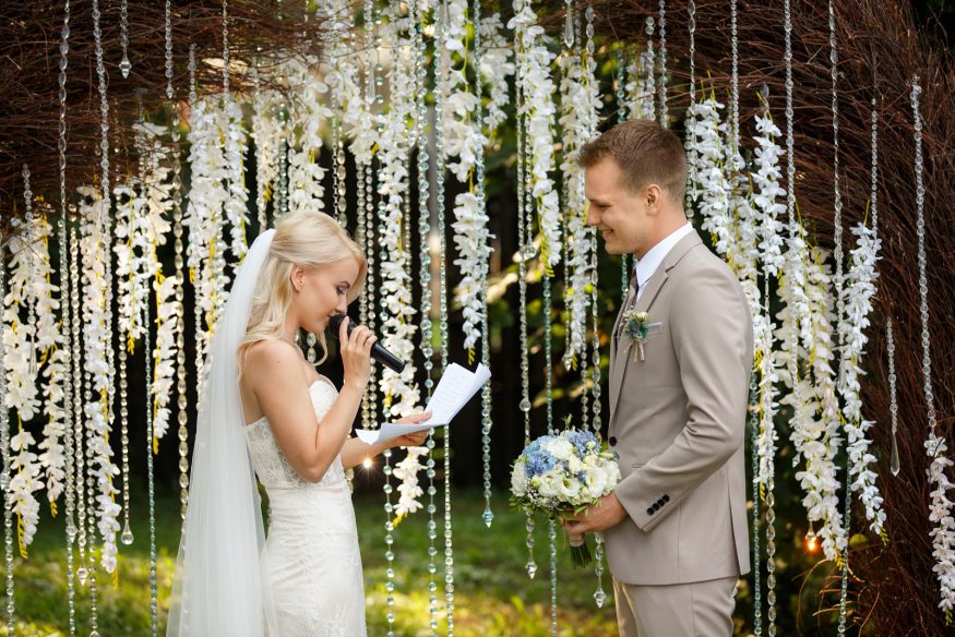 Marriage quotes: A bride and groom read their vows at the altar