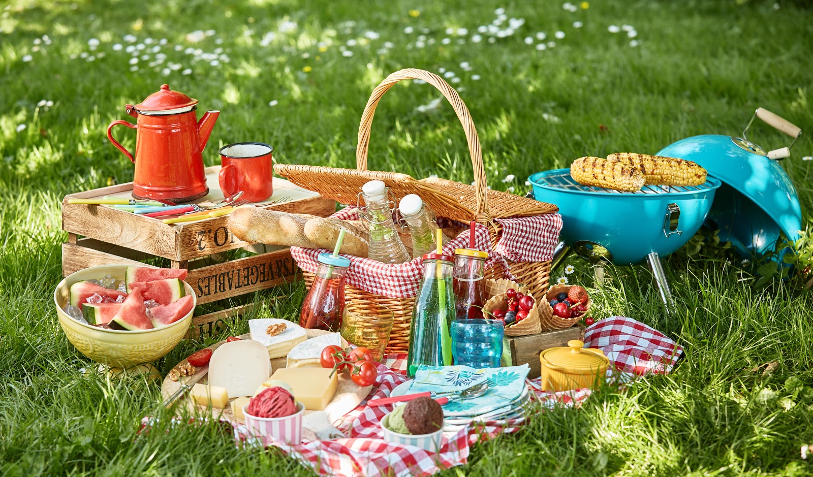 An array of picnic food on the grass