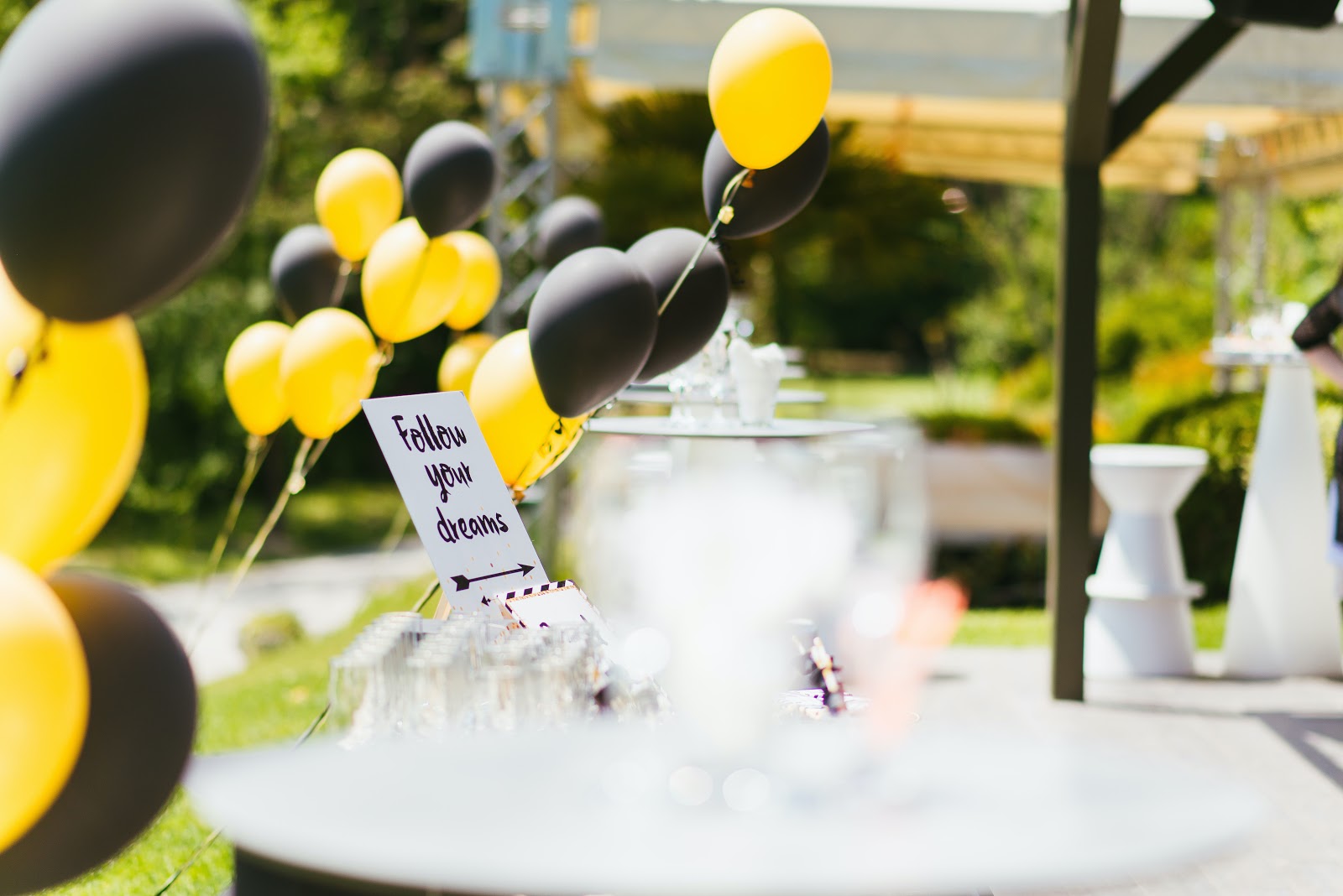 Black and yellow balloon on a party table