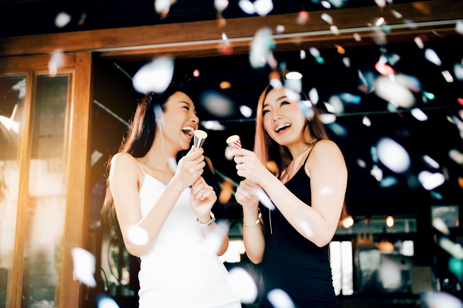 Two female graduates celebrating