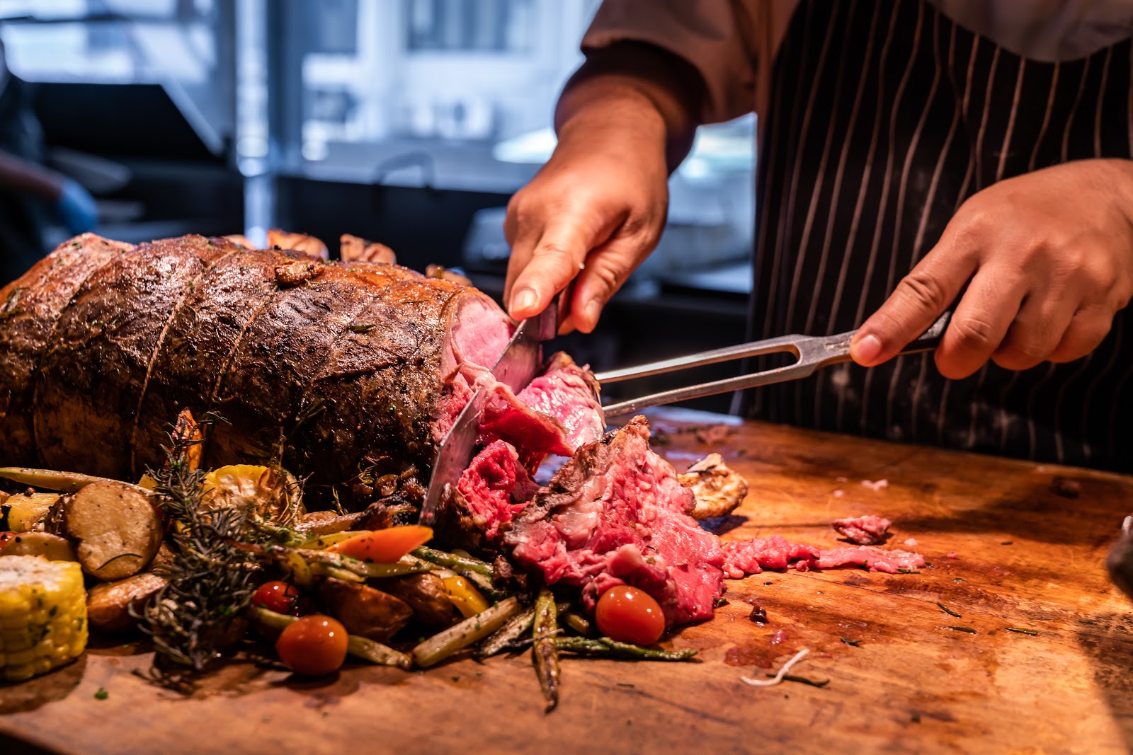 Christmas party food ideas: A home chef carves a prime rib