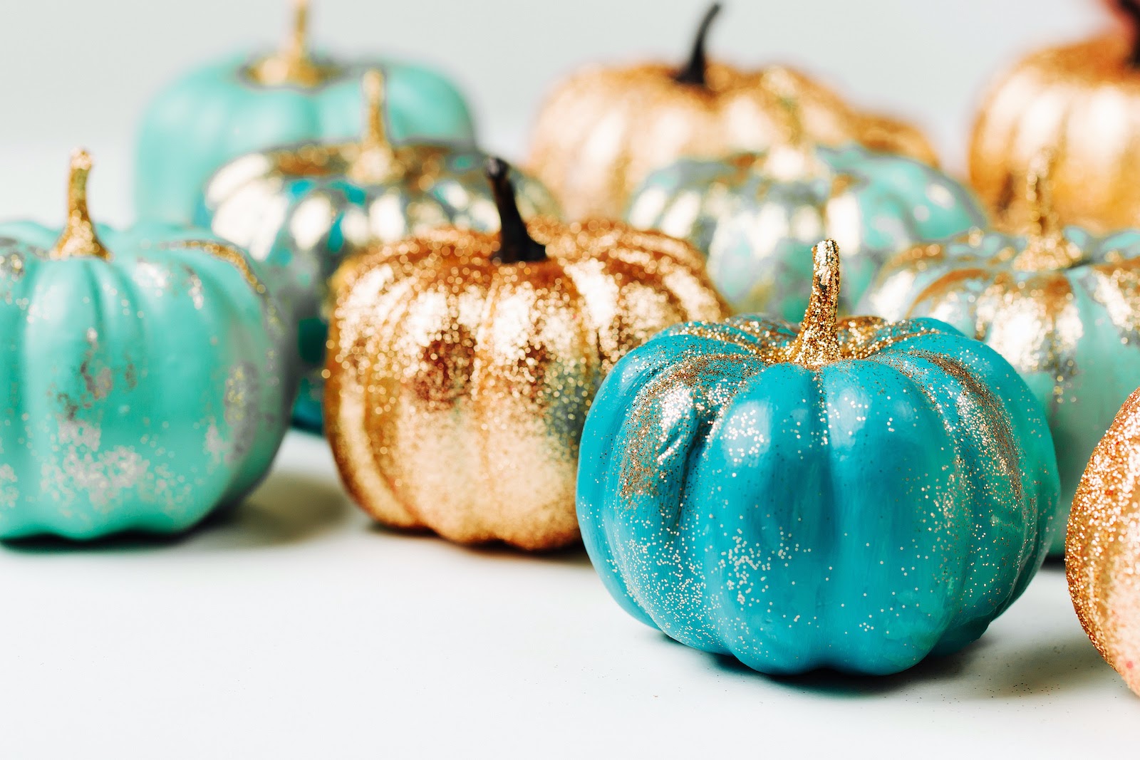 Thanksgiving decoration ideas for pops of color with painted pumpkins.