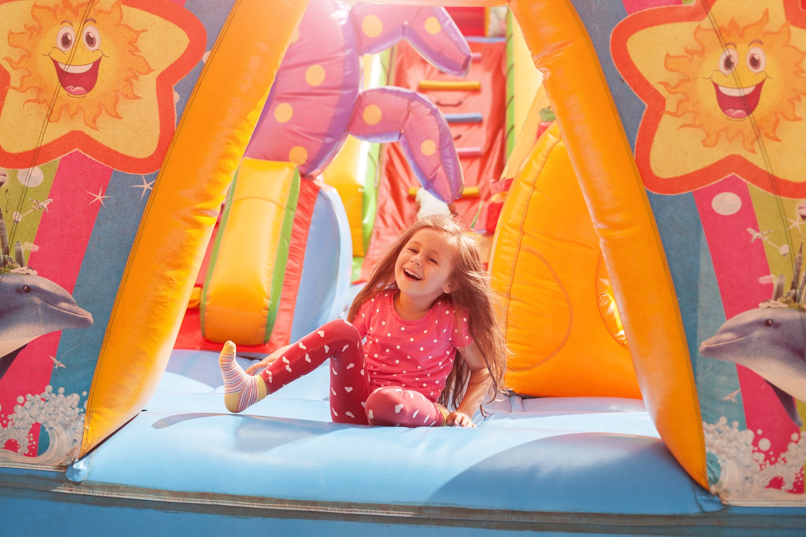 Party games for kids: Child playing in inflatable tent