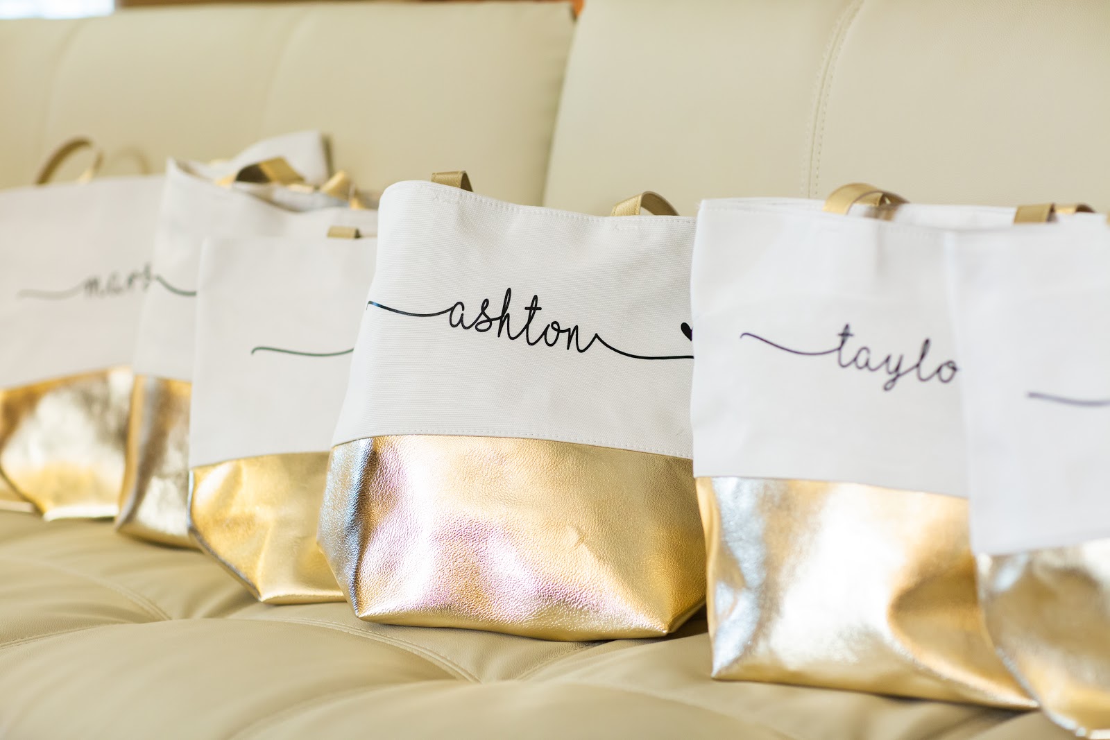 bridesmaid proposal ideas: Monogrammed tote bags on a couch