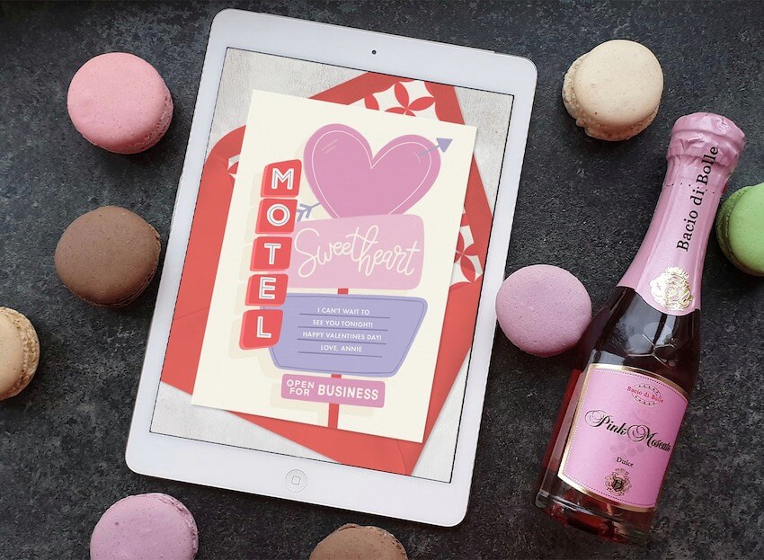 Online valentine cards: Valentine's Day Card on a tablet beside a wine bottle