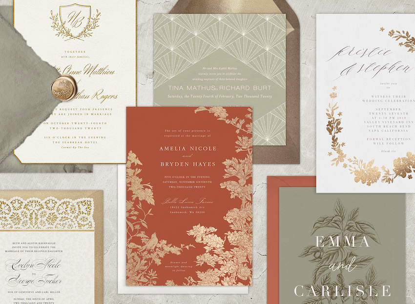 Six vintage wedding invitations laid out with their envelopes