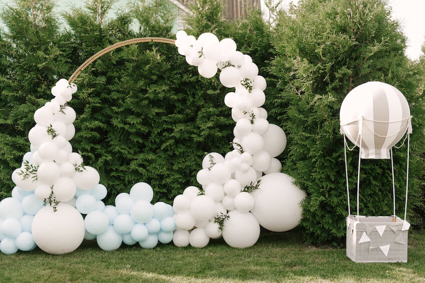 Arch of balloons and a small hot air balloon