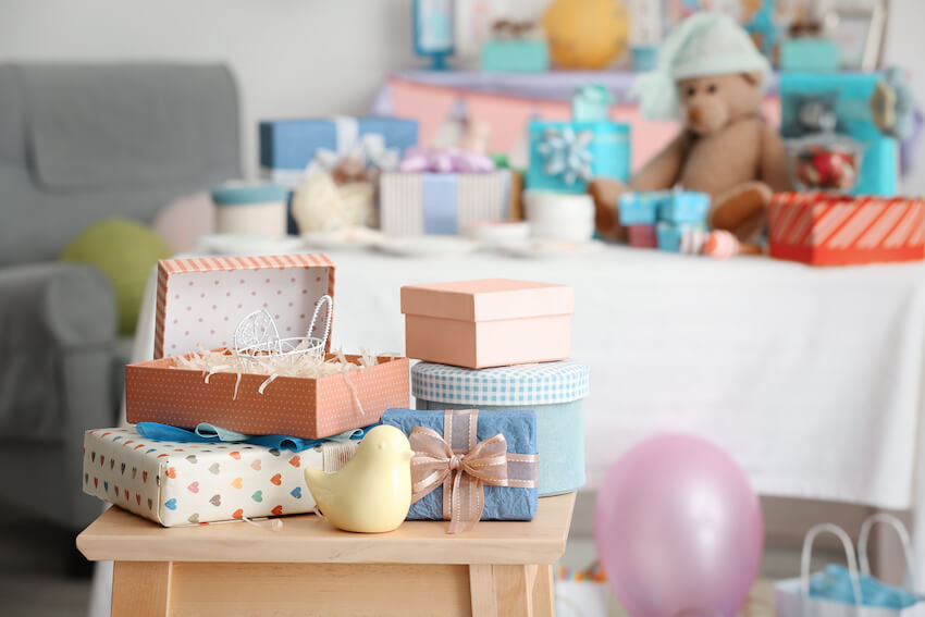 How to plan a baby shower: baby gifts on a chair