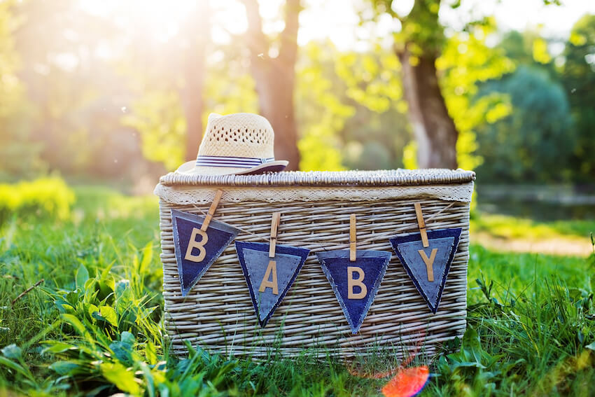 Summer baby shower themes: basket with a BABY sign on it