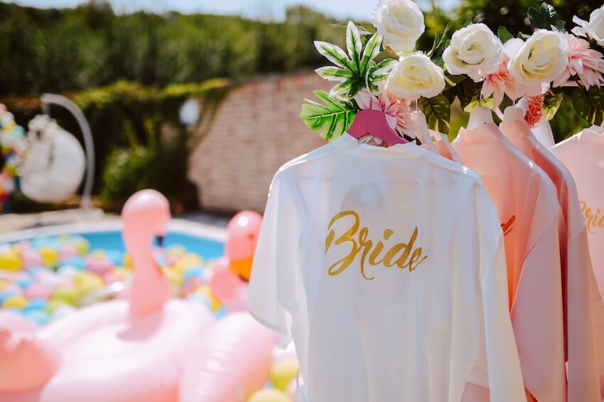 Wild bachelorette party ideas: bathrobes hanging on a rack