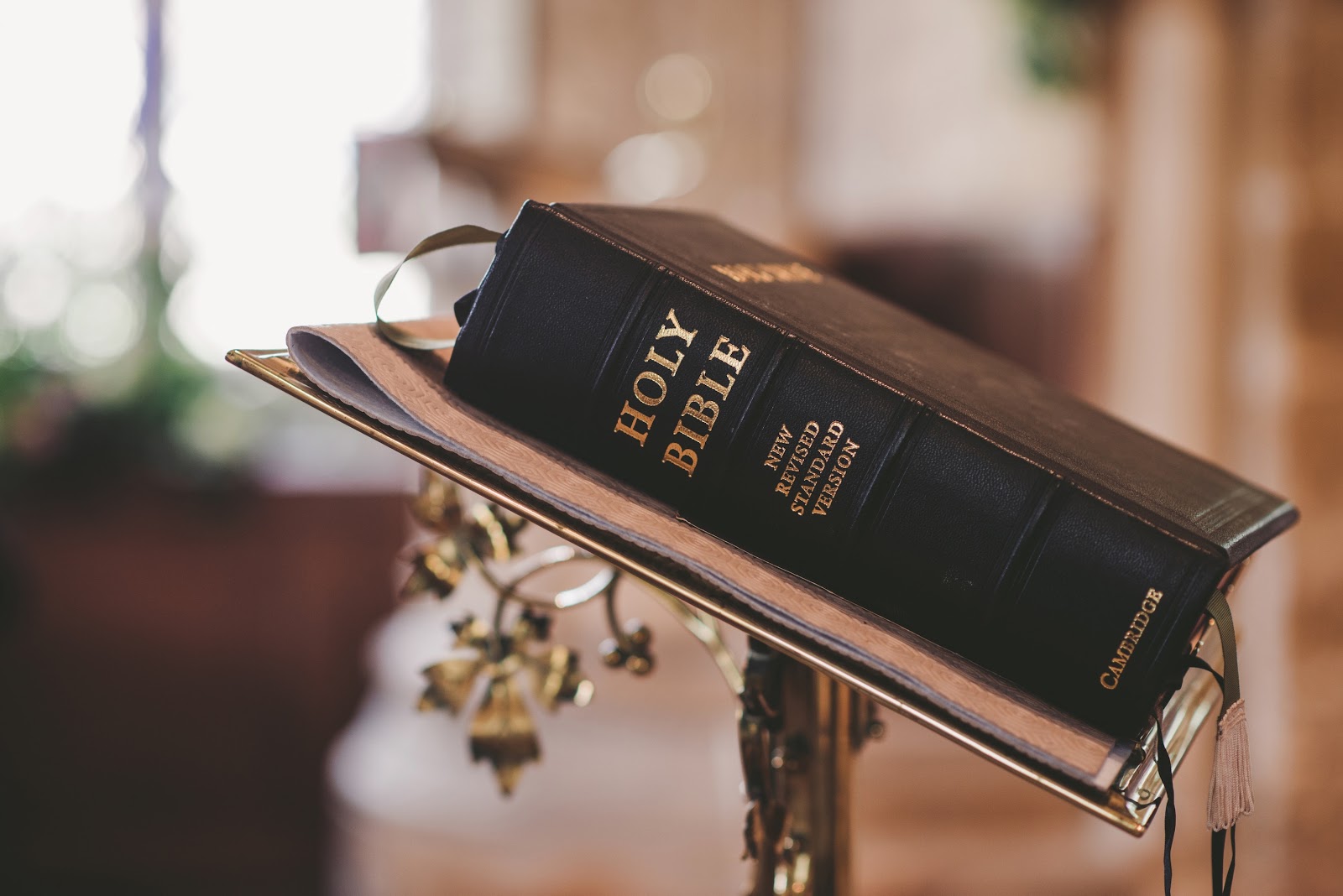 A bible on an ornate pedestal
