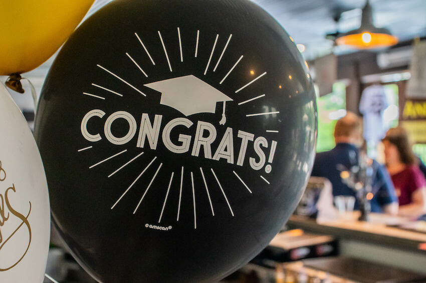 Graduation party: black balloon with the word CONGRATS designed on it