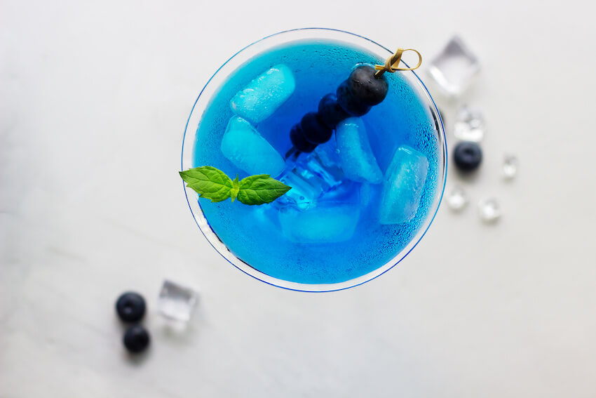 Blue cocktail with mint and blueberries