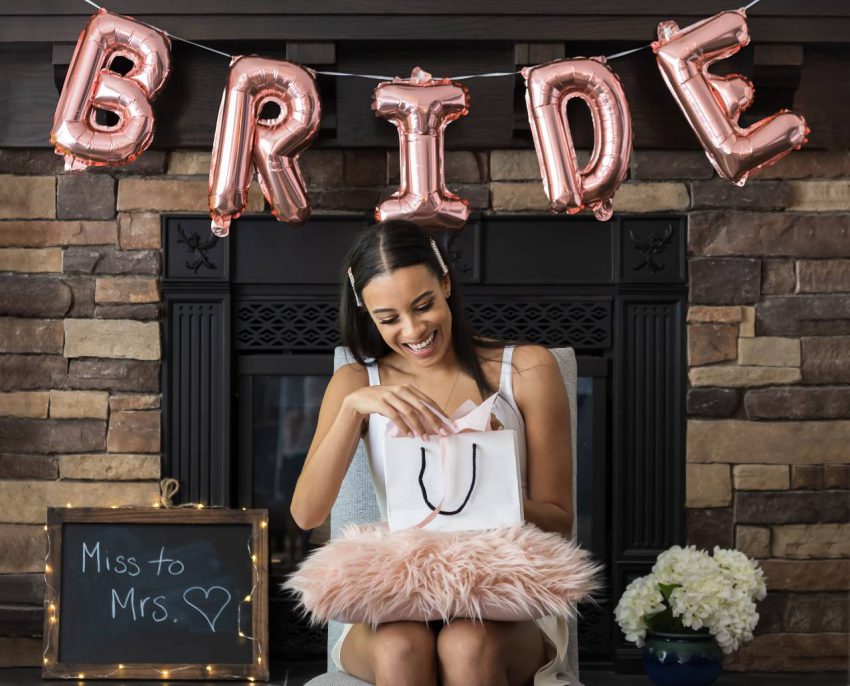 Bridal shower card message: Bride-to-be reading a gift card