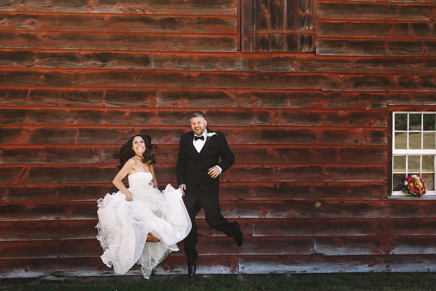Funny elopement announcements: bride and groom doing the jump shot