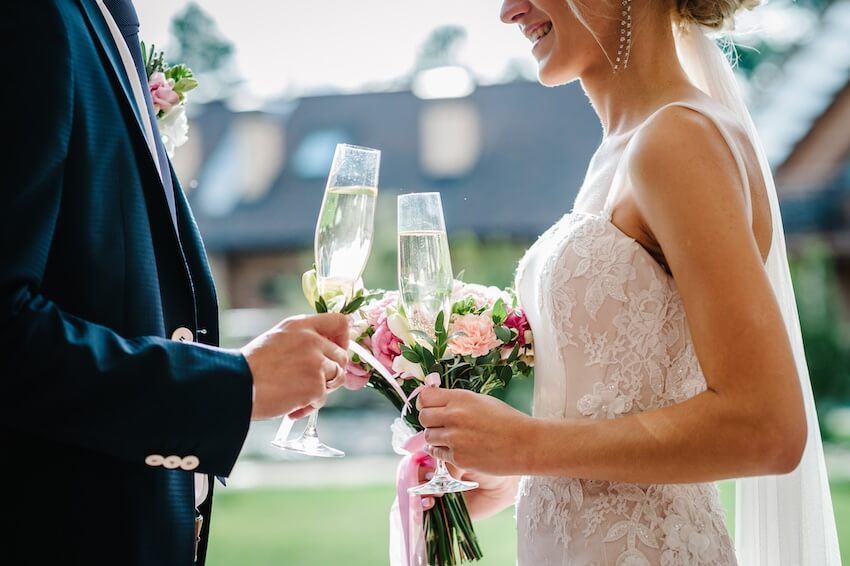 Bride and groom having a toast at their wedding