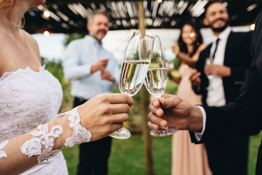 Who goes to the rehearsal dinner: bride and groom having a toast