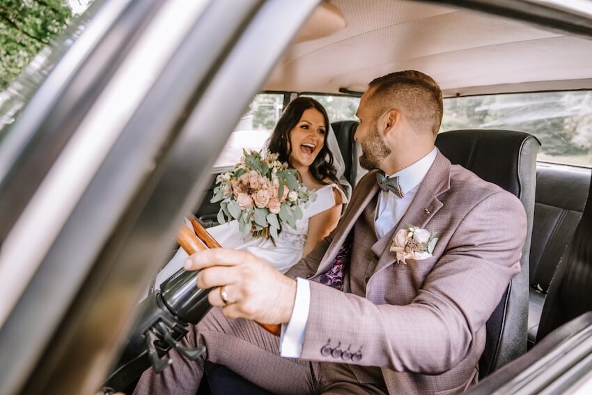 Bride and groom in a car