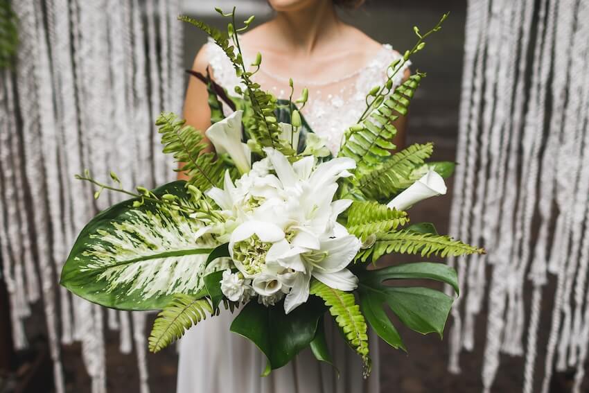 Bride holding a big wedding bouquet