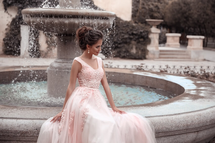 Non white wedding dresses: bride wearing a blush pink colored gown