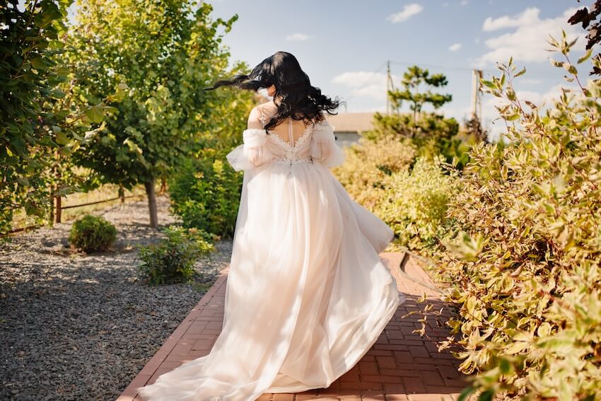 Bride wearing an off white colored wedding dress