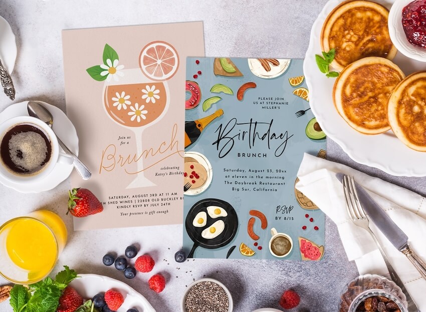 Brunch invitations and a variety of food on a table