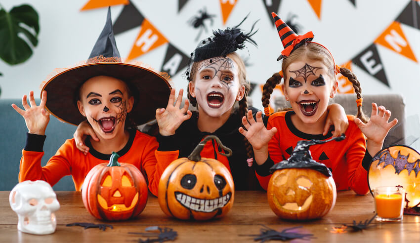 Halloween party invite wording: children wearing costumes and celebrating Halloween