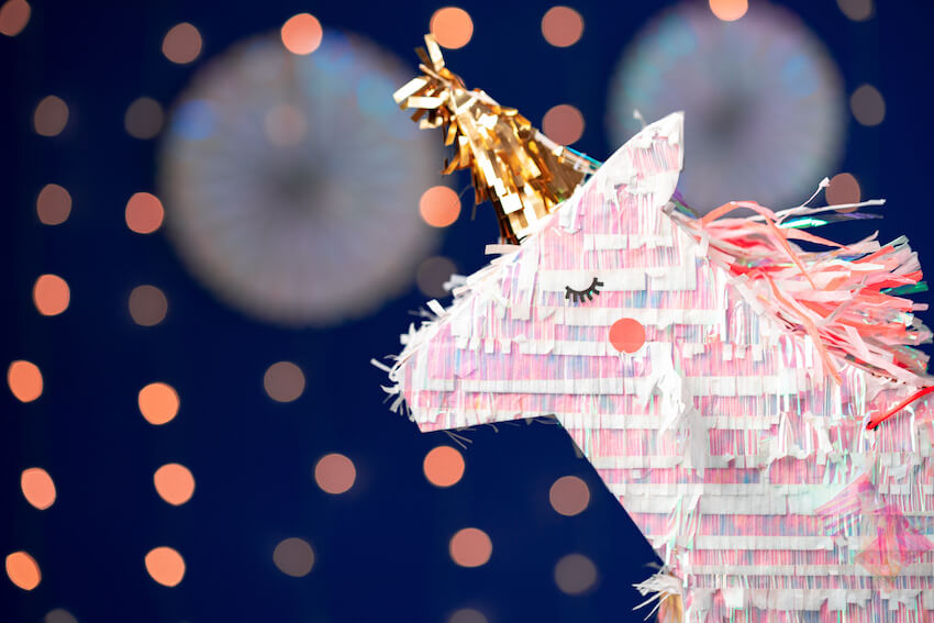 Unicorn birthday decorations: close up shot of a unicorn-shaped piñata