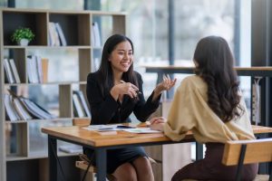 Thank you notes for coworkers: co-workers talking to each other