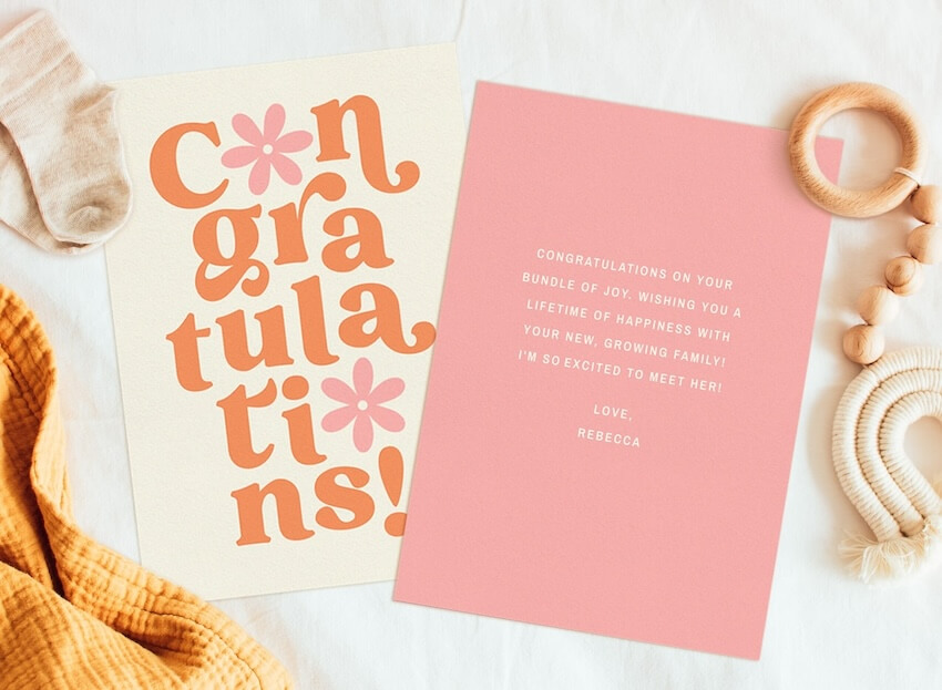 Baby shower card message: congratulations card on a table