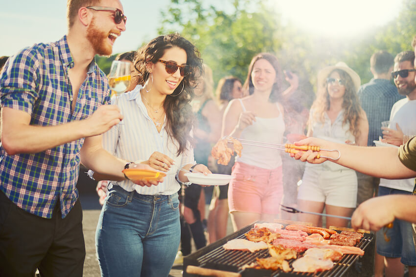 Wedding shower: couple eating and drinking at a backyard barbecue