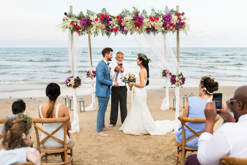 Beach wedding: couple getting married on a beach