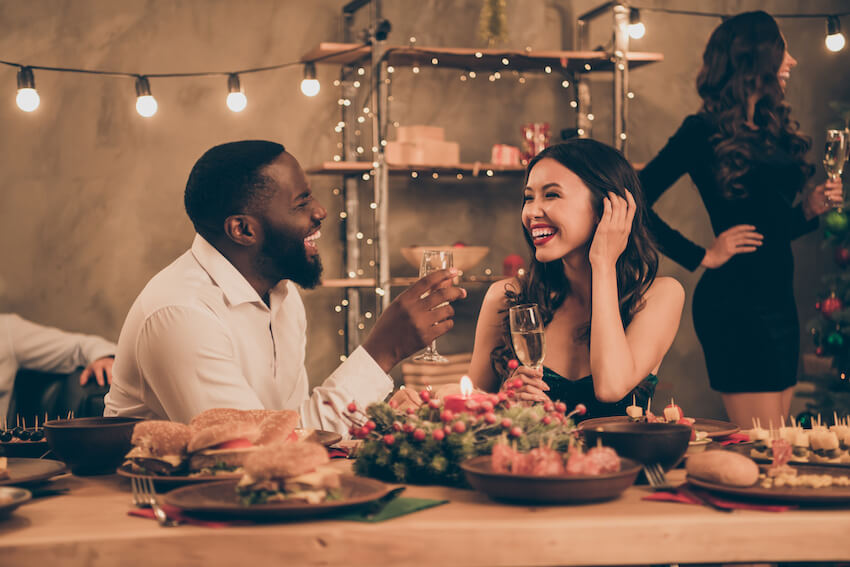 Christmas theme ideas: couple happily talking at a party