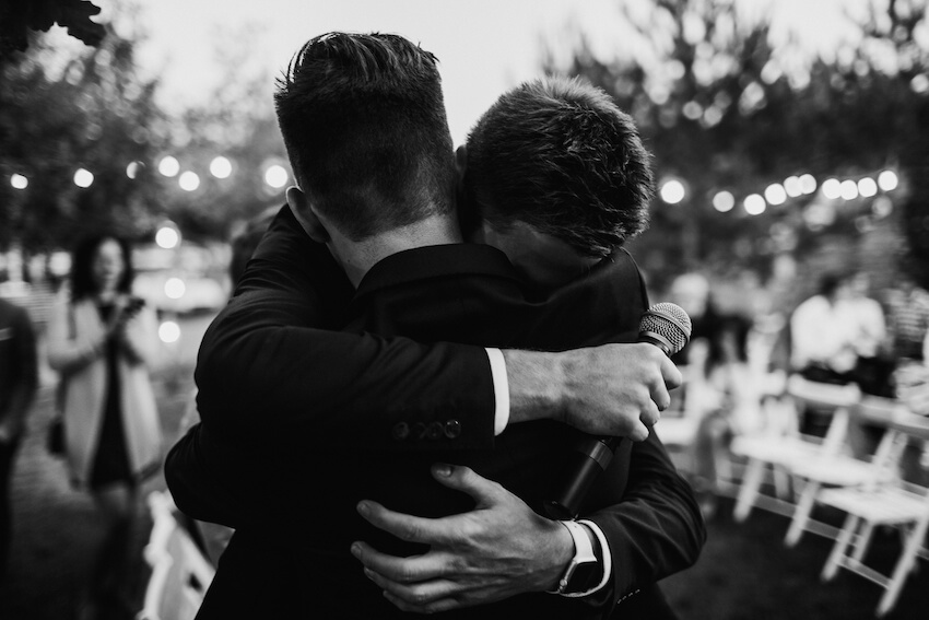 Toast in wedding: couple hugging each other