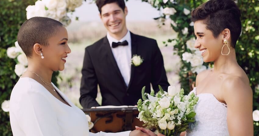 Couple smiling at each other at their wedding