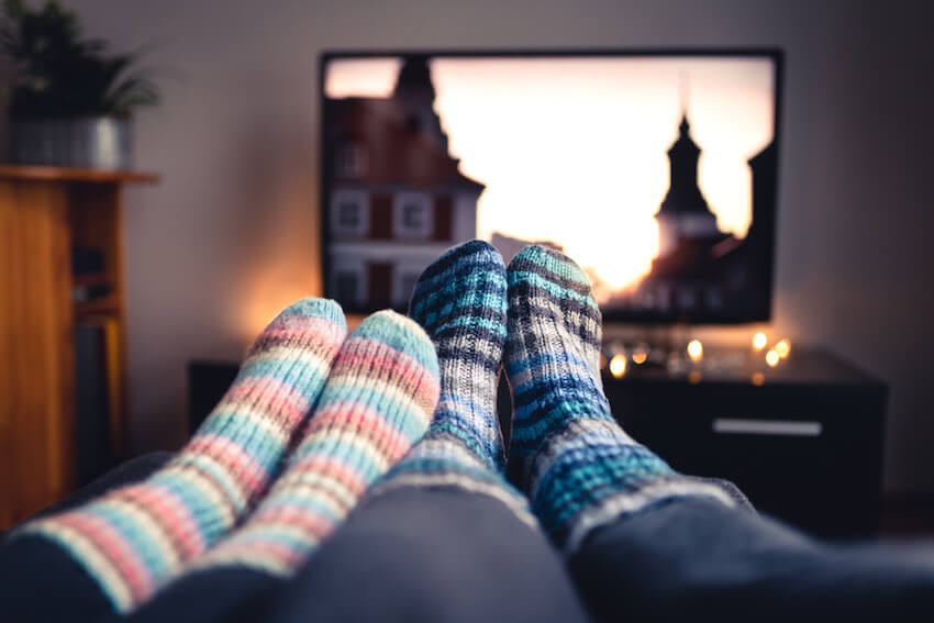 Couple watching a movie and wearing comfortable socks