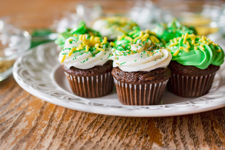 Green-themed cupcakes on a plate