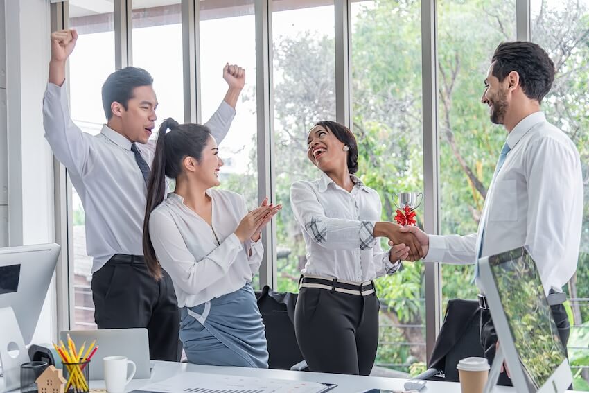 Congratulations on your work anniversary: employees congratulating their colleague