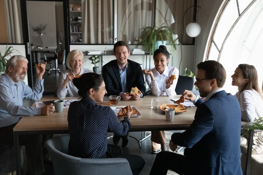 Luncheon invitation: employees happily eating together