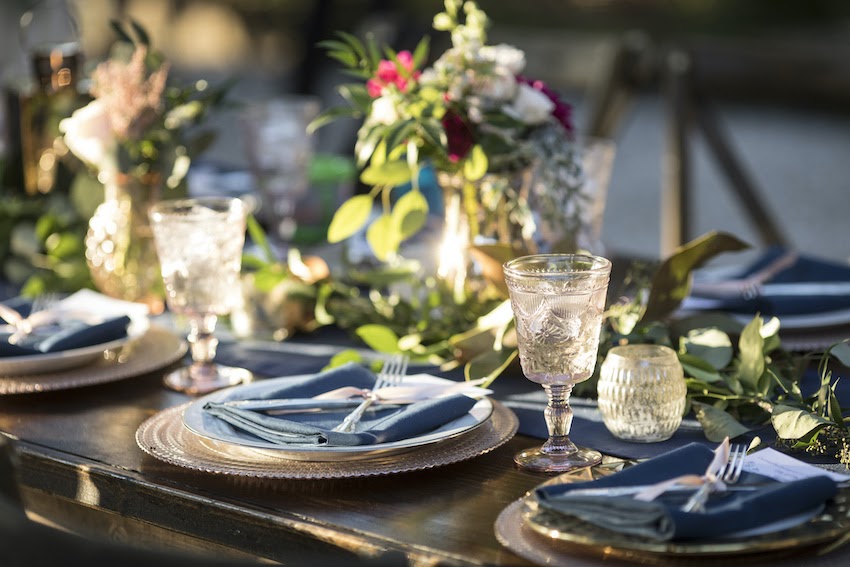 Event planning: Vintage place settings and floral arrangements on a dining table