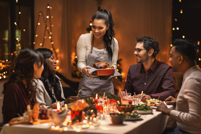 Holiday party: family eating dinner together