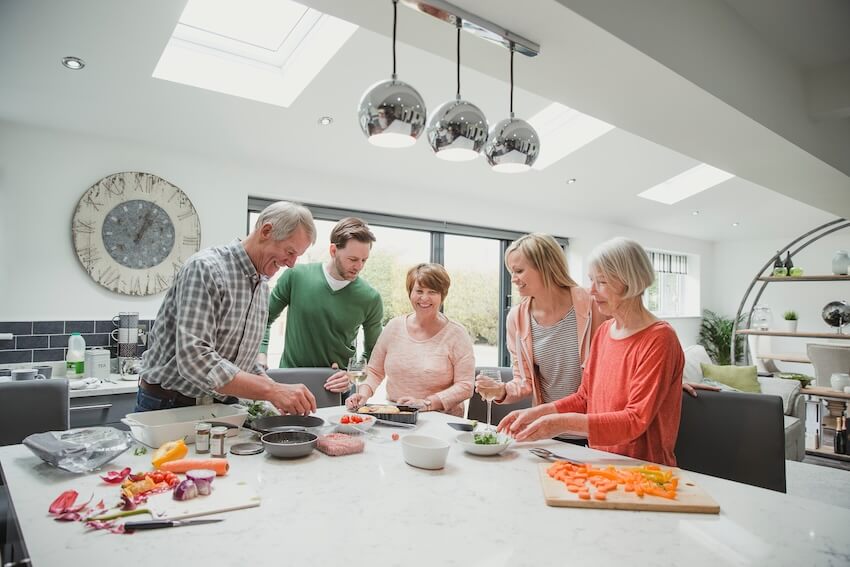 Family happily cooking together