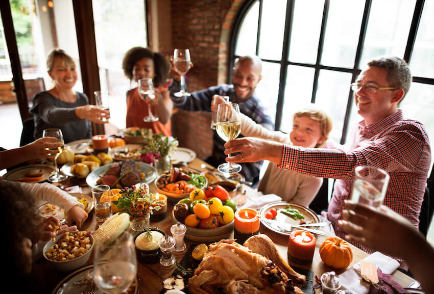 Thanksgiving potluck: family having a toast