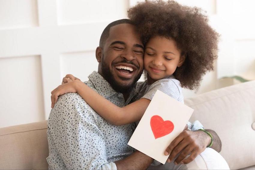 Adoption announcements: father and daughter hugging each other