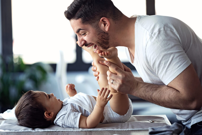 Diaper party: father playing with his son