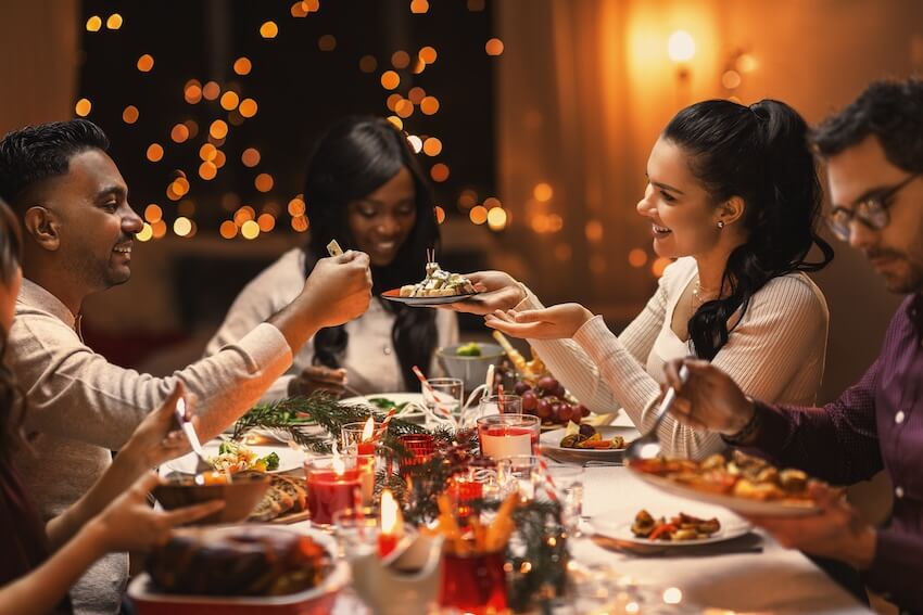 Fun New Years Eve ideas: friends eating dinner together