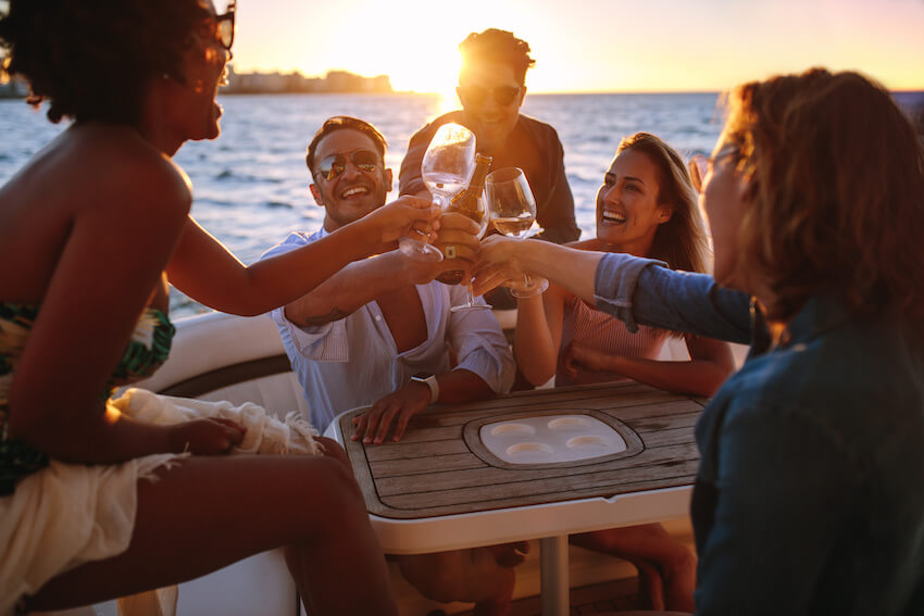 Boat party: friends happily having a toast